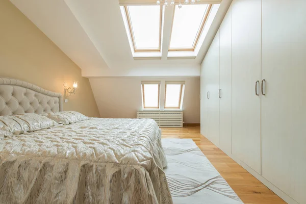 Interior of a luxury loft bedroom with master bed