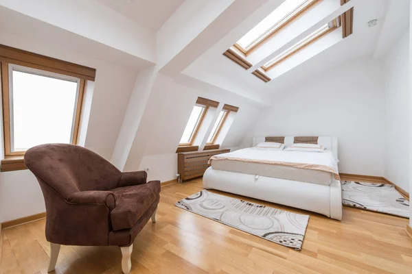 Bedroom interior in luxury loft, attic, apartment with roof wind