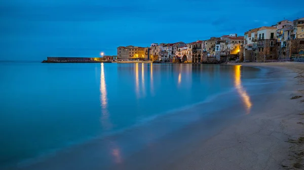 Cefalu, Sicily - Blue hour view of the beautiful Sicilian village of Cefalu with mediterranean sea and traditional italian houses