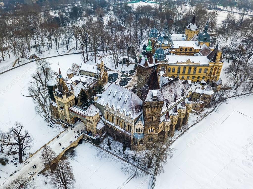 Budapest, Hungary - Aerial view of the beautiful Vajdahunyad Castle and Museum of Hungarian Agriculture in the snowy City Park (Varosliget) at winter time