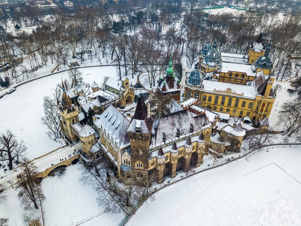 Budapest, Hungary - Aerial view of the beautiful Vajdahunyad Castle and Museum of Hungarian Agriculture in the snowy City Park (Varosliget) at winter time