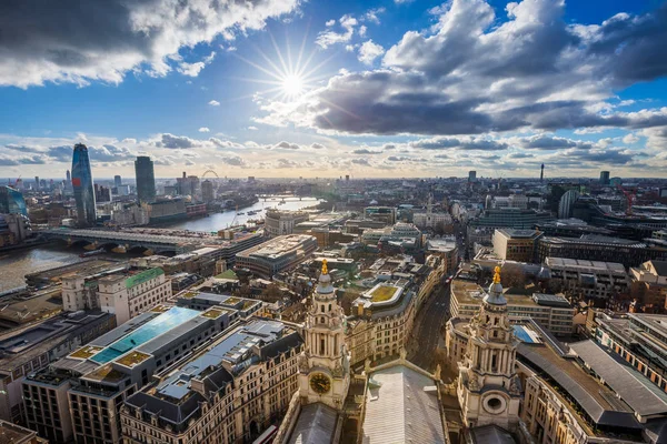 London, England - Panoramic skyline view of London taken from St. Paul's Cathedral with iconic red double-decker buses and beautiful sky and clouds — Stock Photo, Image