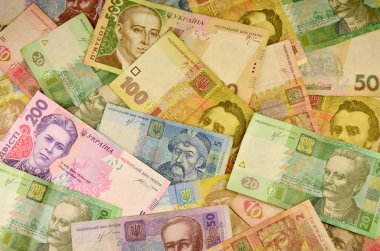 Farklı renk ve boyut birçok Ukraynalı banknotların arka plan görüntüsü. Ukrayna bankacılık işlemleri için kavramsal görüntü çekilme fonları, zenginlik ve Ukrayna para çok büyük miktarda bulundurma
