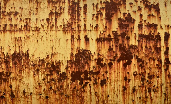 Paslı metal doku çizilmiş yüzeyli. Eski soyulması boya ile metal duvar boyalı. Doku eski boya metal çit yakın çekim