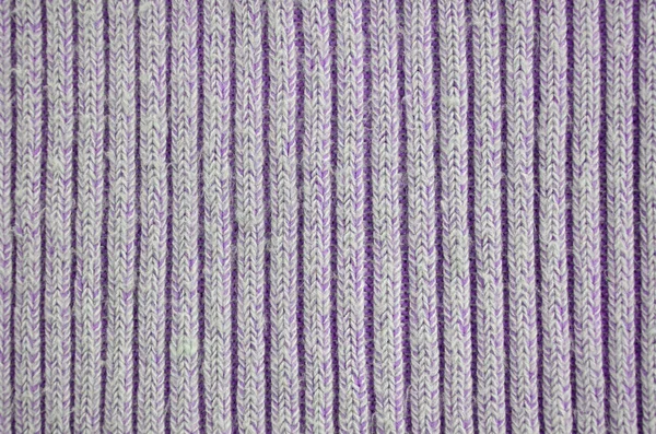 Fabric texture. Cloth knitted, cotton, wool background. Close-up of seamless gray knitted fabric material