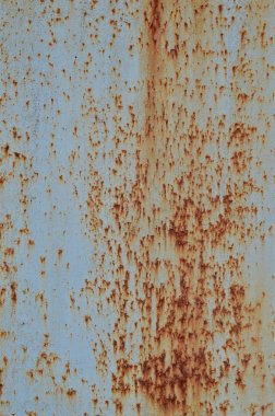 Paslı metal doku çizilmiş yüzeyli. Eski soyulması boya ile metal duvar boyalı. Doku eski boya metal çit yakın çekim