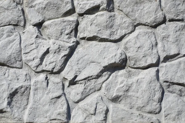 Textura de cerca de concreto com relevo e textura como uma pedra w — Fotografia de Stock