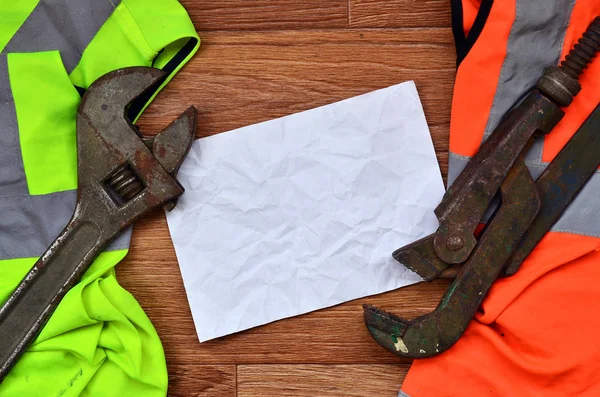 Adjustable Wrenches Paper Lies Orange Green Signal Worker Shirts Still — Stock Photo, Image