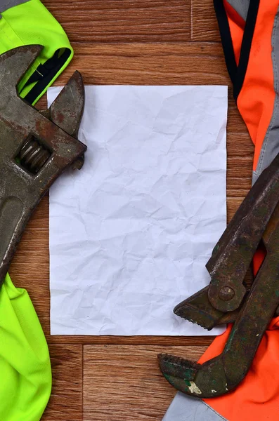 Adjustable Wrenches Paper Lies Orange Green Signal Worker Shirts Still — Stock Photo, Image