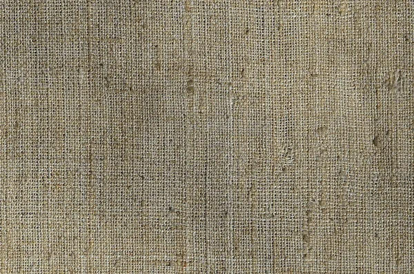 Texture of a gray canvas made of old and coarse burlap. Top view — Stock Photo, Image