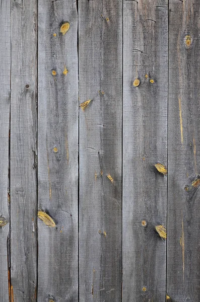 La textura de una antigua cerca de madera rústica hecha de procesado plano —  Fotos de Stock