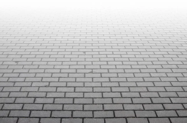 Photo of the site from the old paving slab with small defects an — Stock Photo, Image