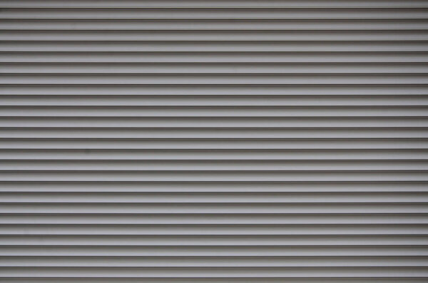 The texture of the shutter door or window in light gray color