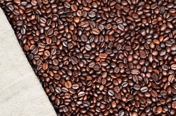 Texture of a gray canvas made of old and coarse burlap with coff