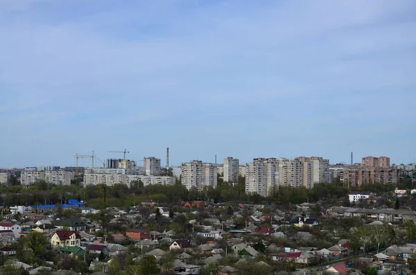 Landscape of an industrial district in the Kharkov city from a bird\'s eye view. A lot of houses and enterprises of Chervonozavodsky district in Kharkov on a sunny clear day