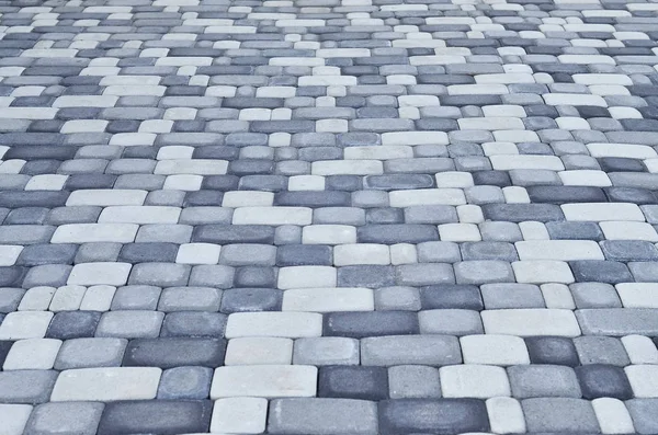 A detailed photo of the square, laid out of modern paving stone with rounded corners — Stock Photo, Image