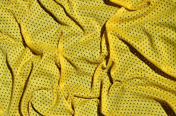 黄色のスポーツ衣料品ファブリックのテクスチャ背景 — ストック写真
