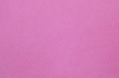 Tüylü pembe Polar kumaş battaniye. Arka plan dokusu hafif pembe yumuşak peluş Polar malzeme