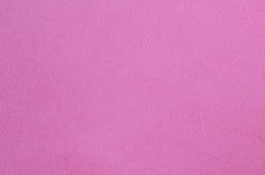 Tüylü pembe Polar kumaş battaniye. Arka plan dokusu hafif pembe yumuşak peluş Polar malzeme