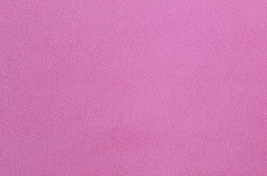 Tüylü pembe Polar kumaş battaniye. Arka plan dokusu hafif pembe yumuşak peluş Polar malzeme