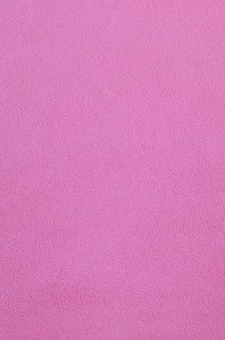 Tüylü pembe Polar kumaş battaniye. Arka plan dokusu hafif pembe yumuşak peluş Polar malzeme