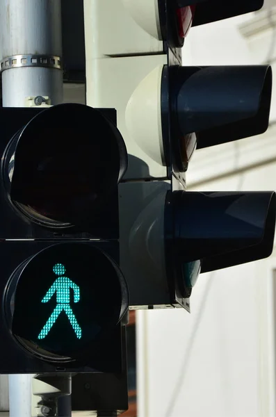 Road light is green and shows the ability of pedestrians to cross the road