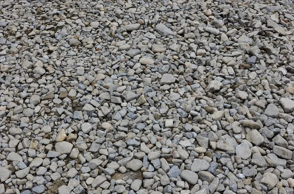 Texture of many crushed stones. Crushed stone is a solid base material for foundation