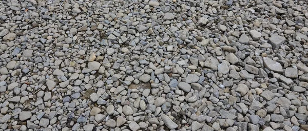 Texture of many crushed stones. Crushed stone is a solid base material for foundation