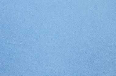 Tüylü mavi Polar kumaş battaniye. Arka plan doku ışık mavi yumuşak peluş Polar malzeme
