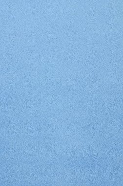 Tüylü mavi Polar kumaş battaniye. Arka plan doku ışık mavi yumuşak peluş Polar malzeme