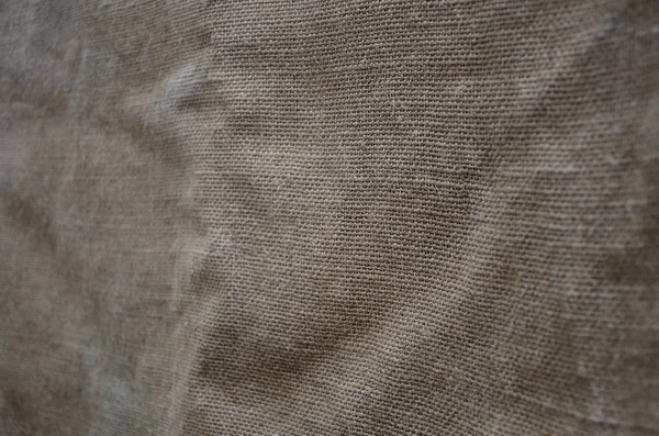 The texture of a very old brown sack cloth. Retro texture with canvas material. Background image with copy space