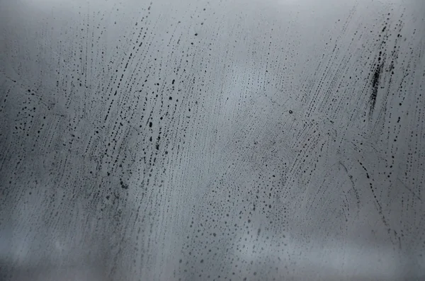 Window glass with condensate or steam after heavy rain, Texture or background image