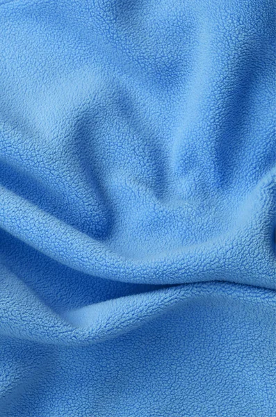 Κουβέρτα Γούνινο Μπλε Φλις Ύφασμα Ένα Φόντο Του Υλικού Φωτός — Φωτογραφία Αρχείου