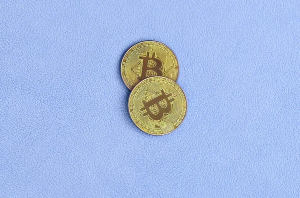 Dois Bitcoins Dourados Está Cobertor Feito Tecido Azul Claro Macio — Fotografia de Stock