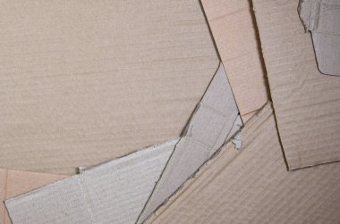 Bir sürü ev aletleri ve posta paketleri taşıma kutuları yapmak için kullanılan bej karton kağıt arka plan görüntüsü. Karton doku