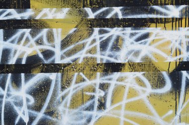 Arka plan resmi bir beton duvar soyut grafiti desen bir parçası ile. Sokak sanatı, vandalizm ve gençlik Hobiler