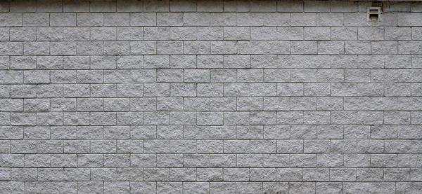 Wall of light texture tiles, stylized in appearance as a brick. One of the types of wall decoration
