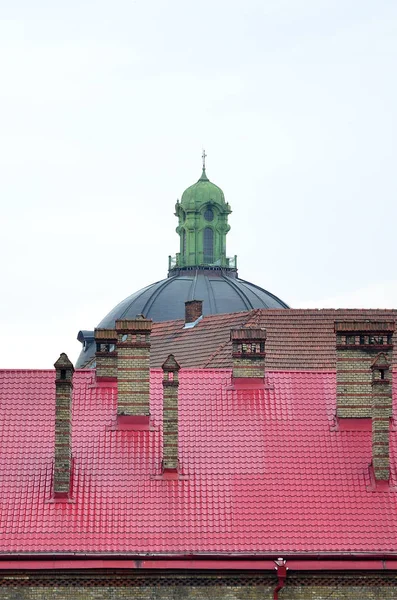 Fragment of a metal roof of the restored old multi-storey building in Lviv, Ukraine