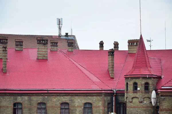 Fragment of a metal roof of the restored old multi-storey building in Lviv, Ukraine