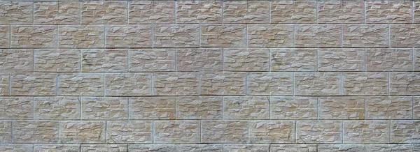 Wall of light texture tiles, stylized in appearance as a brick. One of the types of wall decoration