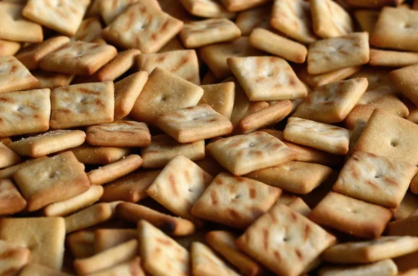 Sok Cookie Kis Négyzet Alakú Minta Egy Sárga Cracker Sózott — Stock Fotó