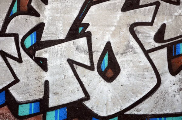 Texture of a fragment of the wall with graffiti painting, which is depicted on it. An image of a piece of graffiti drawing as a photo on street art and graffiti culture topics