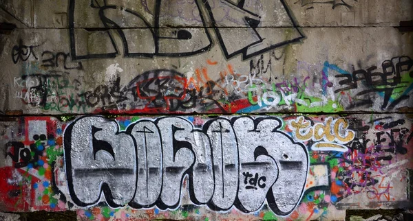 Textur Eines Wandfragments Mit Graffiti Malerei Das Darauf Abgebildet Ist — Stockfoto