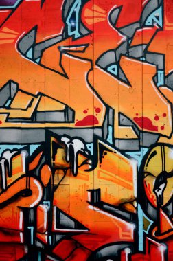 Beton döşeme bir duvara sprey boya ile yapılmış bir çizim ayrıntılı grafiti bir parçası. Arka plan resmini sıcak kırmızı renk tonlarında sokak sanatı