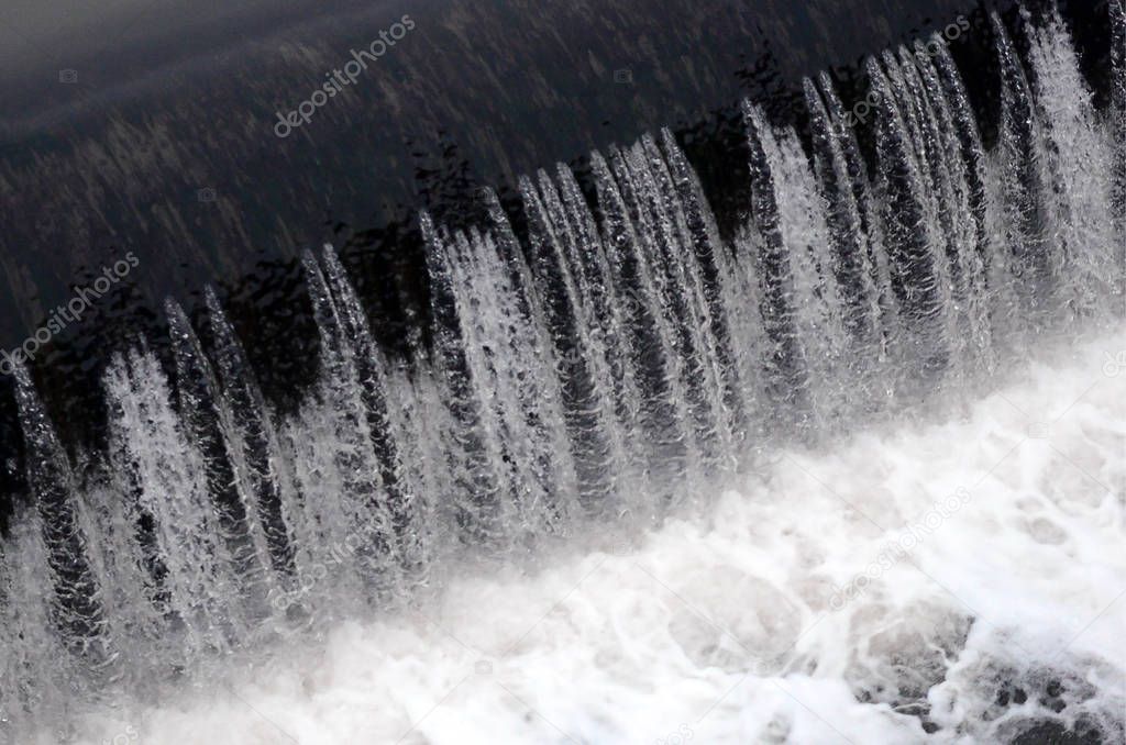 A picture of the flowing water. The dam is designed to regulate the water level in rivers within the city and to provide technical water to industrial objects