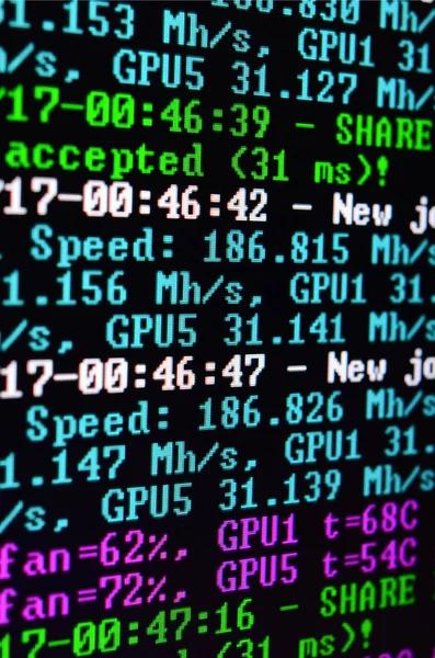 Macro snapshot of the program interface for crypto currency mining on the monitor of an office computer. The concept of mining bitcoins. The flow of information strings and data