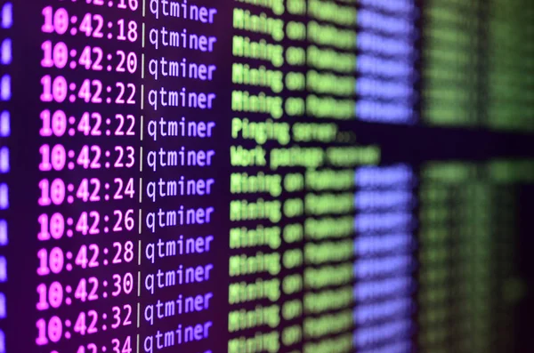 Macro snapshot of the program interface for crypto currency mining on the monitor of an office computer. The concept of mining bitcoins. The flow of information strings and data