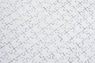 Beyaz jigsaw bulmaca monte durumda doku kapatın. Üstten Görünüm. Büyük bir bütün mozaik birçok bileşenleri birleştirilmiştir