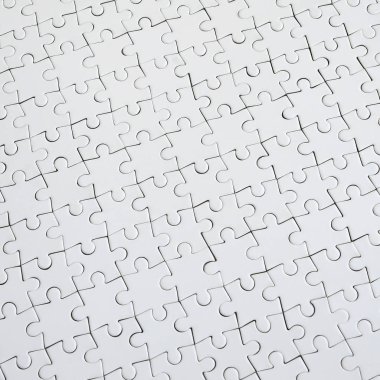 Beyaz jigsaw bulmaca monte durumda doku kapatın. Üstten Görünüm. Büyük bir bütün mozaik birçok bileşenleri birleştirilmiştir