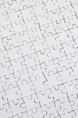 Beyaz jigsaw bulmaca monte durumda doku kapatın. Üstten Görünüm. Büyük bir bütün mozaik birçok bileşenleri birleştirilmiştir
